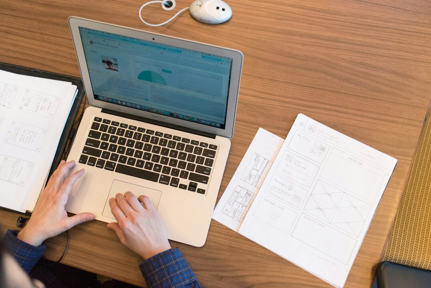 Developer workspace with laptop and code on screen