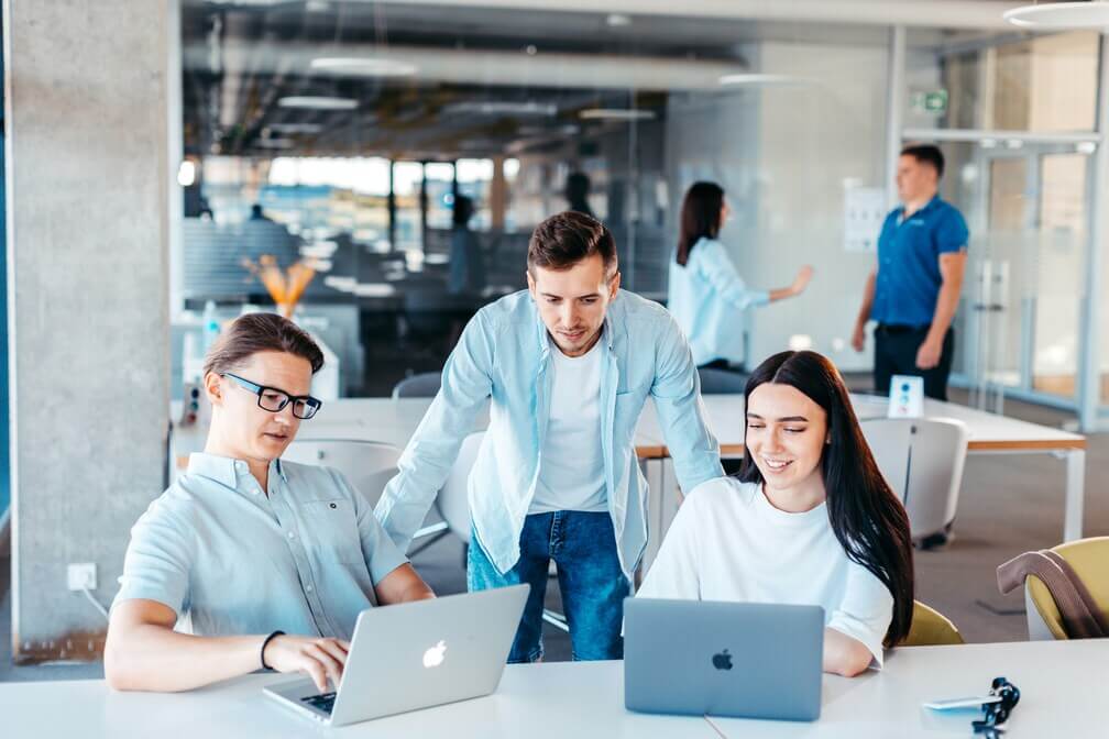 Laptop on desk in bright office space